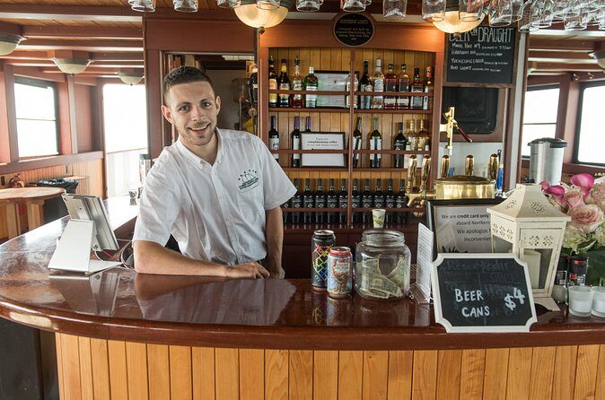 Boston Harbor Night Cruise - The onboard vibe: blankets, staff energy, and the drinks-and-snacks setup
