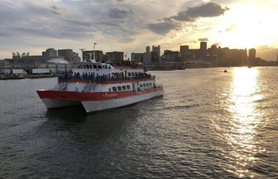 Boston: Scenic Moonlight Harbor Cruise - Onboard vibe: radio soundtrack, snacks, and the comfort reality